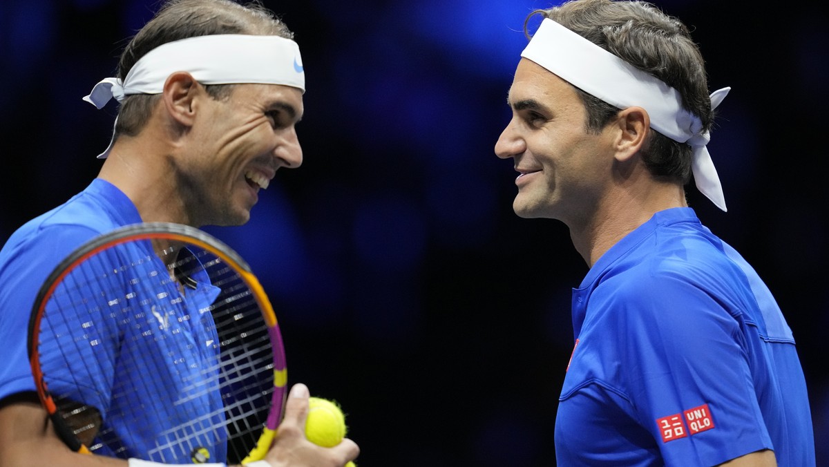 Team Europe's Roger Federer, right, and Rafael Nadal react during their Laver Cup doubles match against Team World's Jack Sock and Frances Tiafoe at the O2 arena in London, Friday, Sept. 23, ...