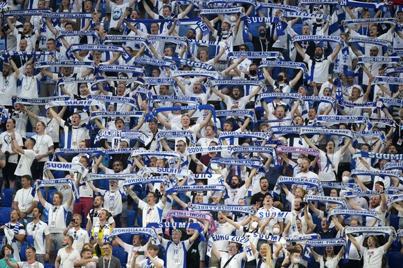 Fans of Finland sing the national anthem of their country before the Euro 2020 soccer championship group B match between Finland and Belgium at Saint Petersburg stadium, in St. Petersburg, Russia, Mon ...