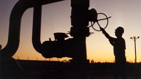 An undated photo provided by the Energy Department shows a silhouetted technician working on one of the Reserve&#039;s wellheads at an undisclosed location on the U.S. Gulf Coast. The United States&#0 ...