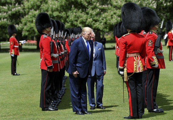 U.S President Donald Trump inspects an honour guard with Britain&#039;s Prince Charles during a welcome ceremony in the garden of Buckingham Palace, in London, Monday, June 3, 2019, on the first day o ...