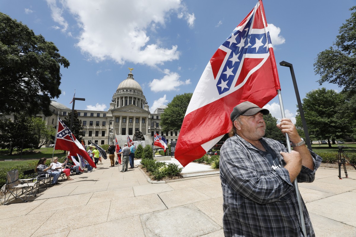 "I love this flag," states David Flynt of Hattiesburg, while standing outside the state Capitol with other current Mississippi flag supporters in Jackson, Miss., Sunday, June 28, 2020. Lawma ...
