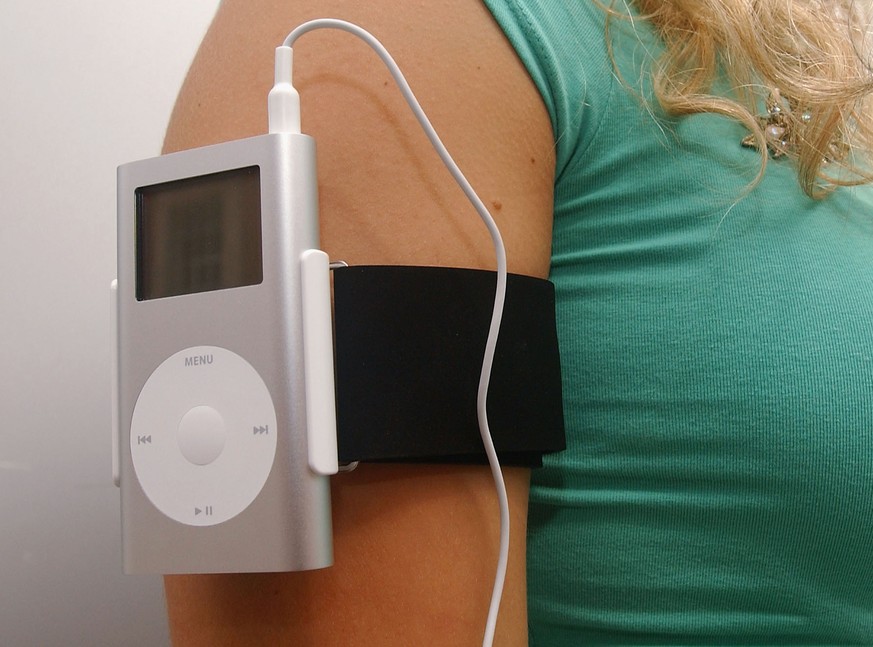 LONDON - JULY 16: A Model displays the new Apple iPod product at the Apple iPod mini press launch on July 16, 2004 in London. (Photo by Steve Finn/Getty Images)