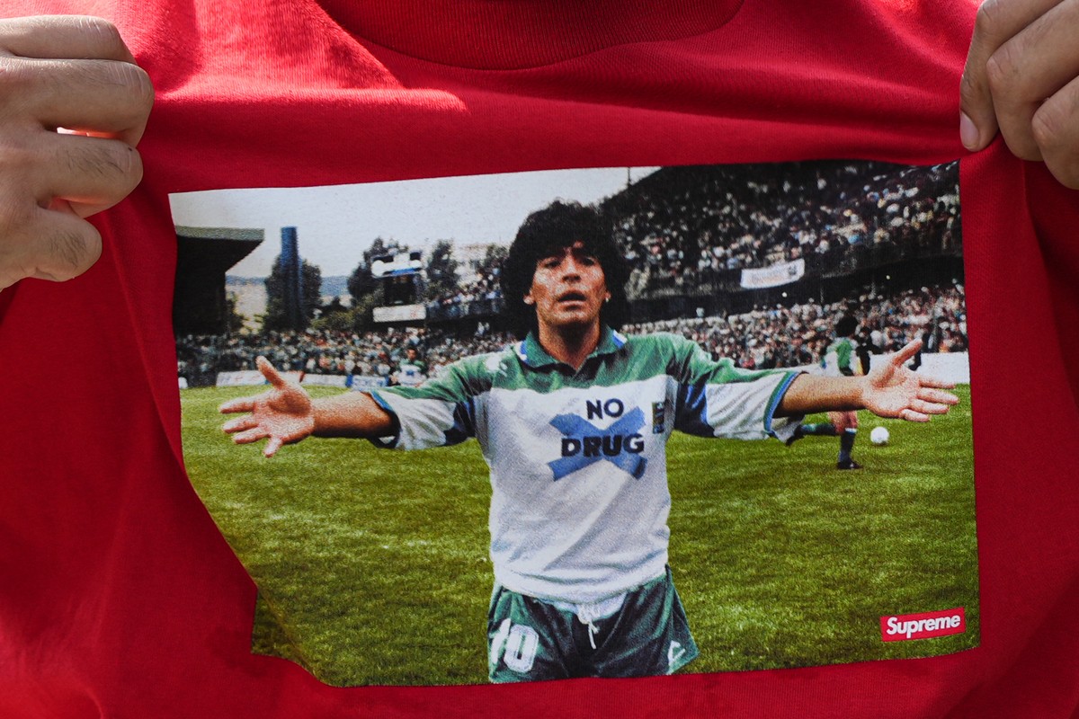 A fan wears a shirt depicting Argentinian player Diego Maradona during the World Cup final soccer match between Argentina and Spain, Sunday, July 19, 2026, at the FIFA Fan Zone on the National Mall in ...