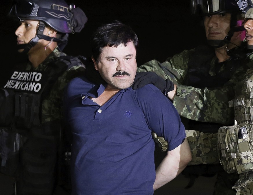epa07365162 (FILE) - Mexican drug lord Joaquin &#039;El Chapo&#039; Guzman escorted by authorities after his detention, in Mexico City, Mexico, 08 May 2016. Media reports that Joaquin &#039;El Chapo&# ...