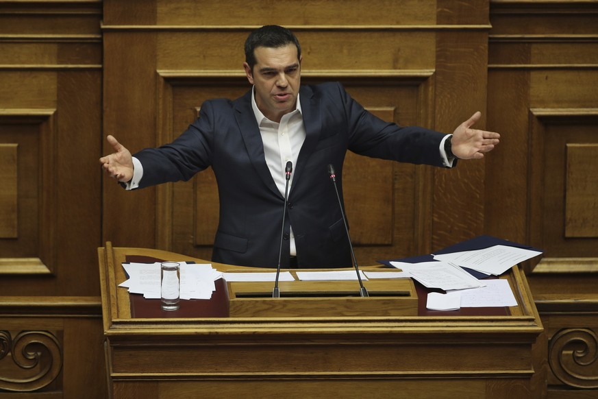 Greek Prime Minister Alexis Tsipras, delivers his speech during a parliamentary session in Athens, on Wednesday, Jan. 16, 2019. Greek lawmakers geared up Wednesday night for a confidence vote in the l ...