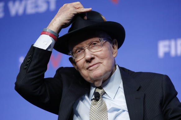 FILE - Former U.S. Sen. Harry Reid tips his hat during a fundraiser for the Nevada Democratic Party, on Nov. 17, 2019, in Las Vegas. Reid, the former Senate majority leader and Nevada
