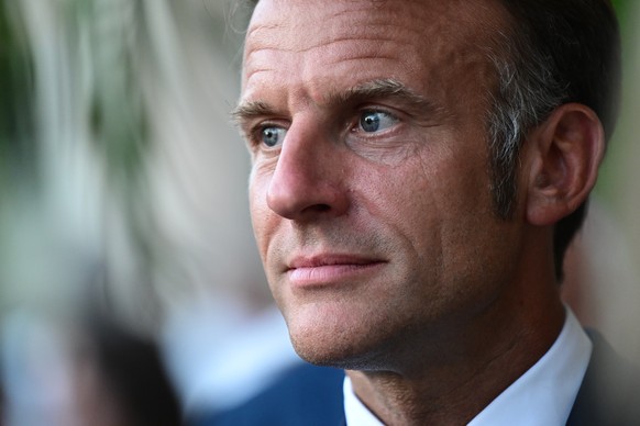 epa12307174 France&#039;s President Emmanuel Macron looks on at the end of a ceremony marking the 81st anniversary of the liberation of Bormes-les-Mimosas during World War II, southeastern France, 17  ...