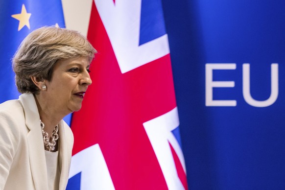 FILE- In this Friday, June 23, 2017 file photo British Prime Minister Theresa May prepares to address a media conference at an EU summit in Brussels. May&#039;s office said on Monday, July 31, 2017 th ...