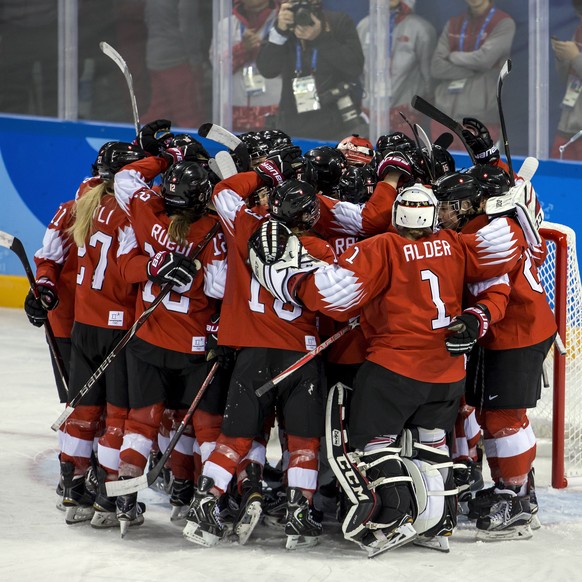 Team of Switzerland celebrate during the women ice hockey preliminary round match between Switzerland and unified Korean team in the Kwandong Hockey Center in Gangneung during the XXIII Winter Olympic ...