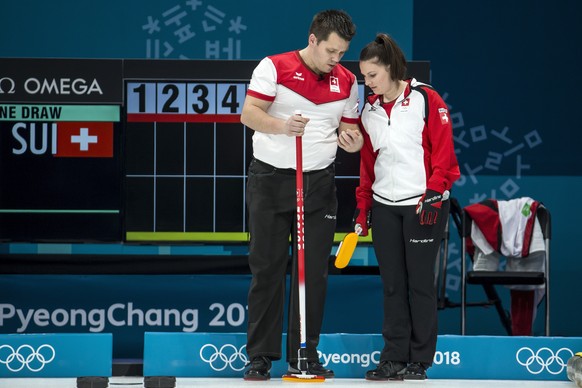 Martin Rios of Switzerland and Jenny Perret of Switzerland, from left, in action during the Mixed Doubles Curling round robin game between Switzerland and Finland one day prior to the opening of the XXIII Winter Olympics 2018 in Gangneung, South Korea, on Thursday, February 08, 2018. (KEYSTONE/Alexandra Wey)