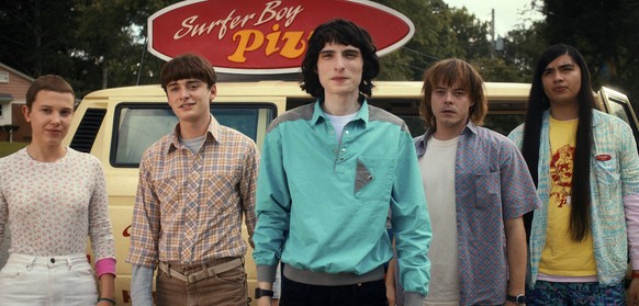 This image released by Netflix shows, from left, Millie Bobby Brown as Eleven, Noah Schnapp as Will Byers, Finn Wolfhard as Mike Wheeler, Charlie Heaton as Jonathan Byers, and Eduardo Franco as Argyle ...