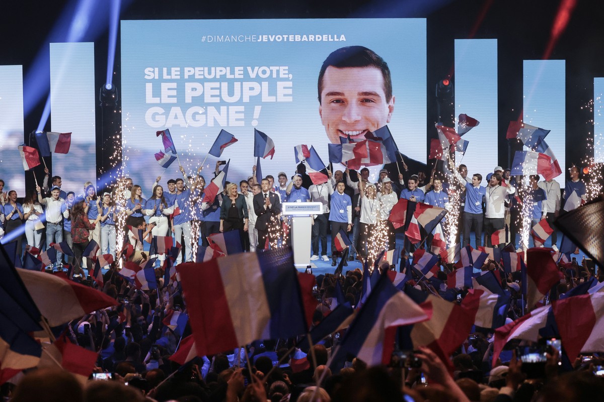 epa11385918 President of the French far-right National Rally party (RN-Rassemblement National in French) Jordan Bardella (C-R) and party's parliamentary leader Marine Le Pen (C-L) react at the en ...