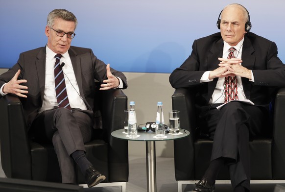 US Secretary of Homeland Security John Kelly, right, and German Interior Minister Thomas de Maiziere sit together in a panel during the Munich Security Conference in Munich, Germany, Saturday, Feb. 18 ...