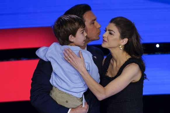 Florida Gov. Ron DeSantis, center, with his wife Casey, right, and son Mason, left, after the CNN Republican presidential debate with former UN Ambassador Nikki Haley at Drake University in Des Moines ...