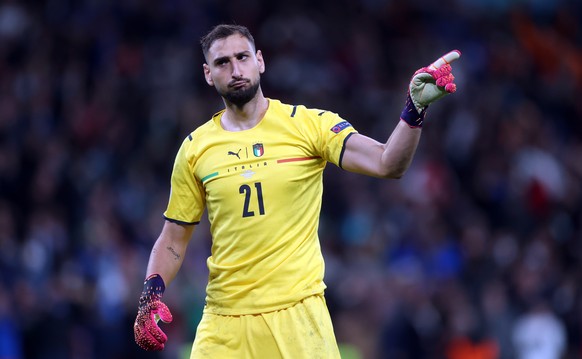 epa09327389 Goalkeeper Gianluigi Donnarumma of Italy reacts during the penalty shoot out during the UEFA EURO 2020 semi final between Italy and Spain in London, Britain, 06 July 2021. EPA/Carl Recine  ...