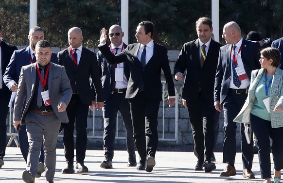 Kosovo&#039;s Prime Minister Albin Kurti, center, waves to the media at the arrival to a meeting with EU High Representative for Foreign Affairs and Security Policy Josep Borrell and EU Special Repres ...