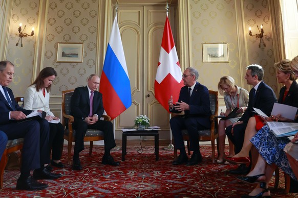 Swiss President Guy Parmelin, center right, and Swiss Foreign Minister Ignazio Cassis, right, attend a bilateral meeting with Russia&#039;s President Vladimir Putin, center left, and Russia&#039;s For ...