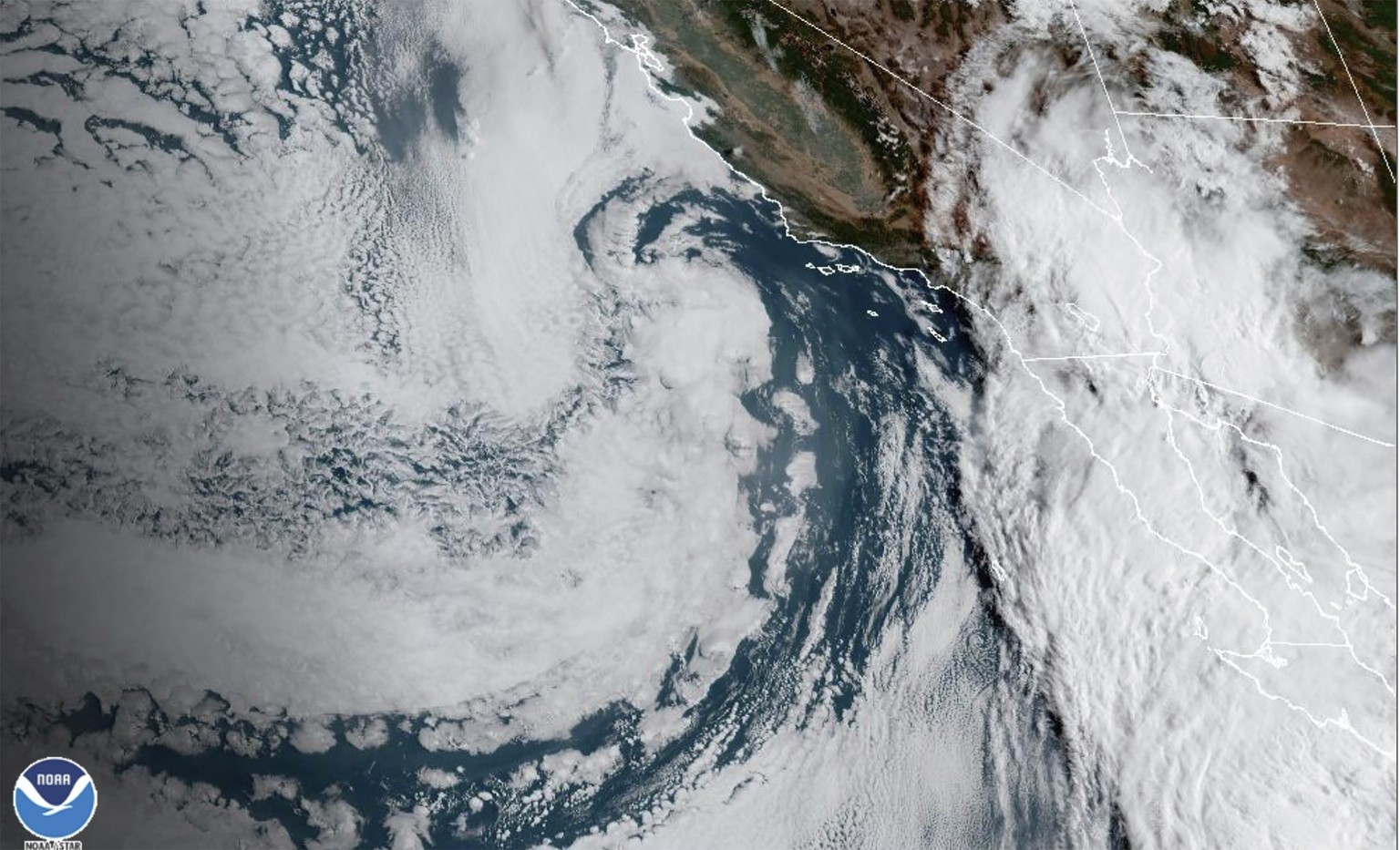 This Saturday, Aug. 19, 2023 11:38 a.m. EDT satellite image provided by the National Oceanic and Atmospheric Administration shows Hurricane Hilary, right, off Mexico?s Pacific coast. Hurricane Hilary  ...