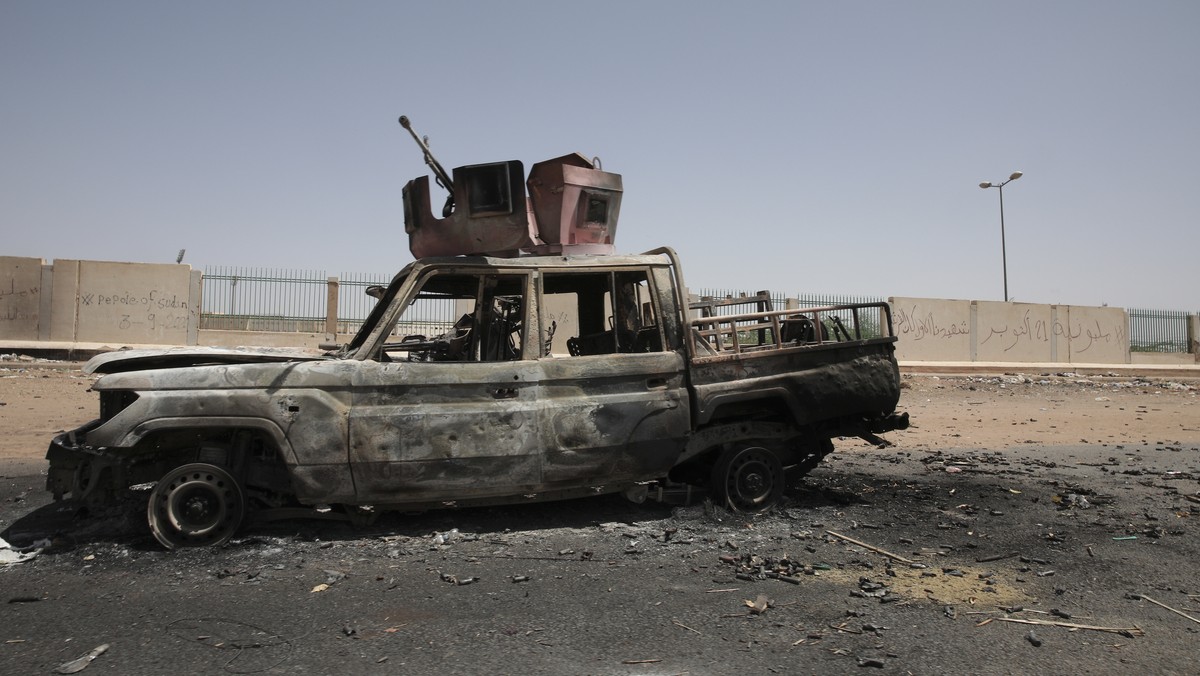 A destroyed military vehicle is seen in southern in Khartoum, Sudan, Thursday, April 20, 2023. The latest attempt at a cease-fire between the rival Sudanese forces faltered as gunfire rattled the capi ...