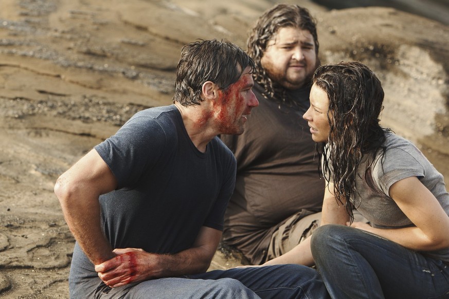 In this publicity image released by ABC, Matthew Fox, left, Jorge Garcia and Evangeline Lilly, right are shown in a scene from the finale of &quot;Lost.&quot; The program was nominated for an Emmy for ...