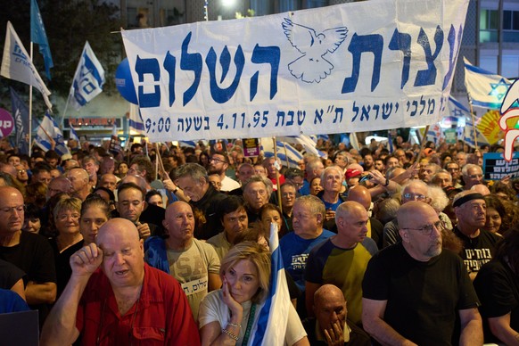 People attend a rally in Tel Aviv, Israel, on Saturday, Nov. 1, 2025, marking 30 years since the assassination of Prime Minister Yitzhak Rabin. (AP Photo/Ariel Schalit)
Israel Rabin Anniversary