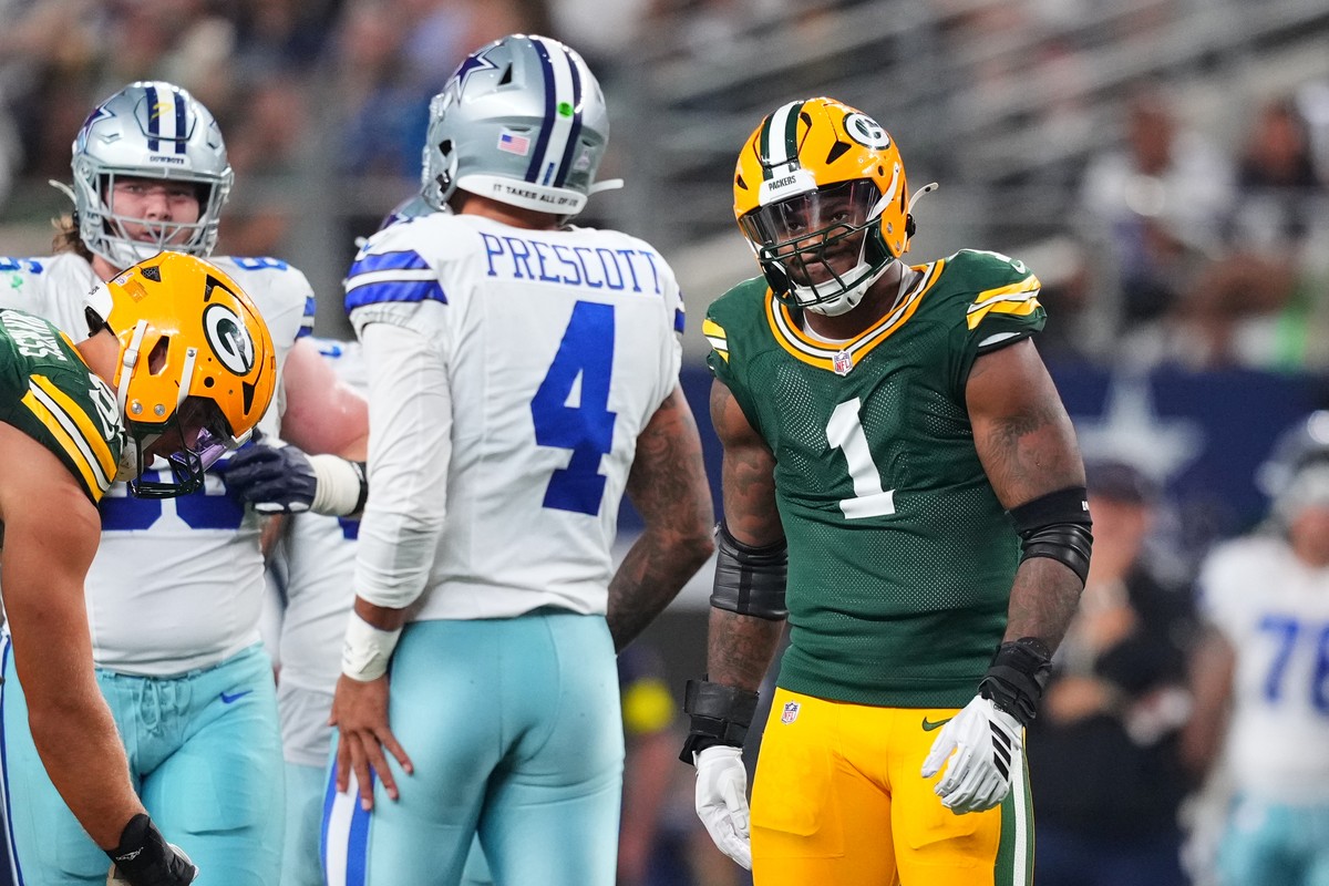 Green Bay Packers defensive end Micah Parsons (1) looks at Dallas Cowboys' Dak Prescott (4) after the end of a play in the second half of an NFL football game Sunday, Sept. 28, 2025, in Arlington ...