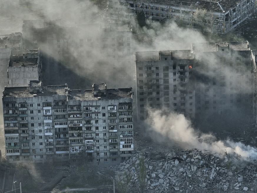 Smoke rises from buildings in this aerial view of Bakhmut, in the Donetsk region, Ukraine, Wednesday, April 26, 2023. (AP Photo/Libkos)