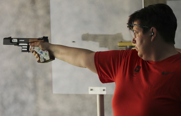 Heidi Diethelm Gerber, left, of Switzerland competes during the women&#039;s 25 meter pistol qualification rapid competition at Olympic Shooting Center at the 2016 Summer Olympics in Rio de Janeiro, B ...