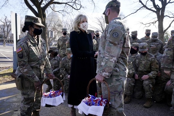 First lady Jill Biden surprises National Guard members outside the Capitol with chocolate chip cookies, Friday, Jan. 22, 2021, in Washington.Â (AP Photo/Jacquelyn Martin, Pool)