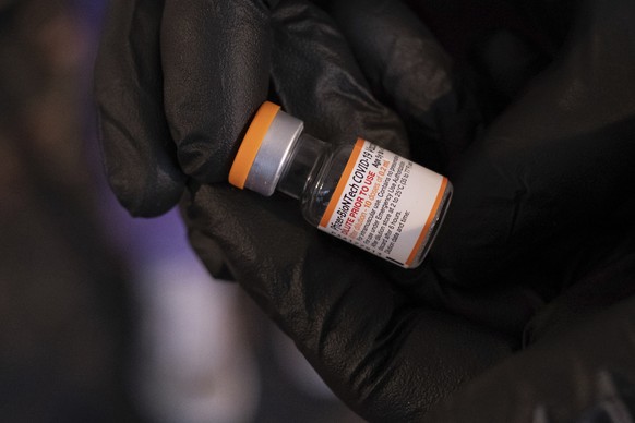 A vial of the Pfizer-BioNTech COVID-19 vaccine for children five to 12 years old is shown at the Viral Solutions vaccination and testing site in Decatur, Ga.,Wednesday, Nov. 3, 2021. The U.S. enters a ...