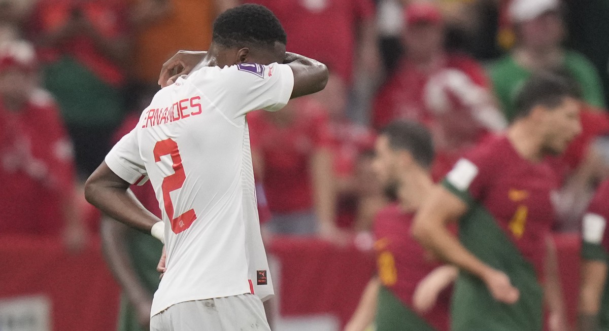 Switzerland's Edimilson Fernandes reacts after Portugal score a goal during the World Cup round of 16 soccer match between Portugal and Switzerland, at the Lusail Stadium in Lusail, Qatar, Tuesda ...