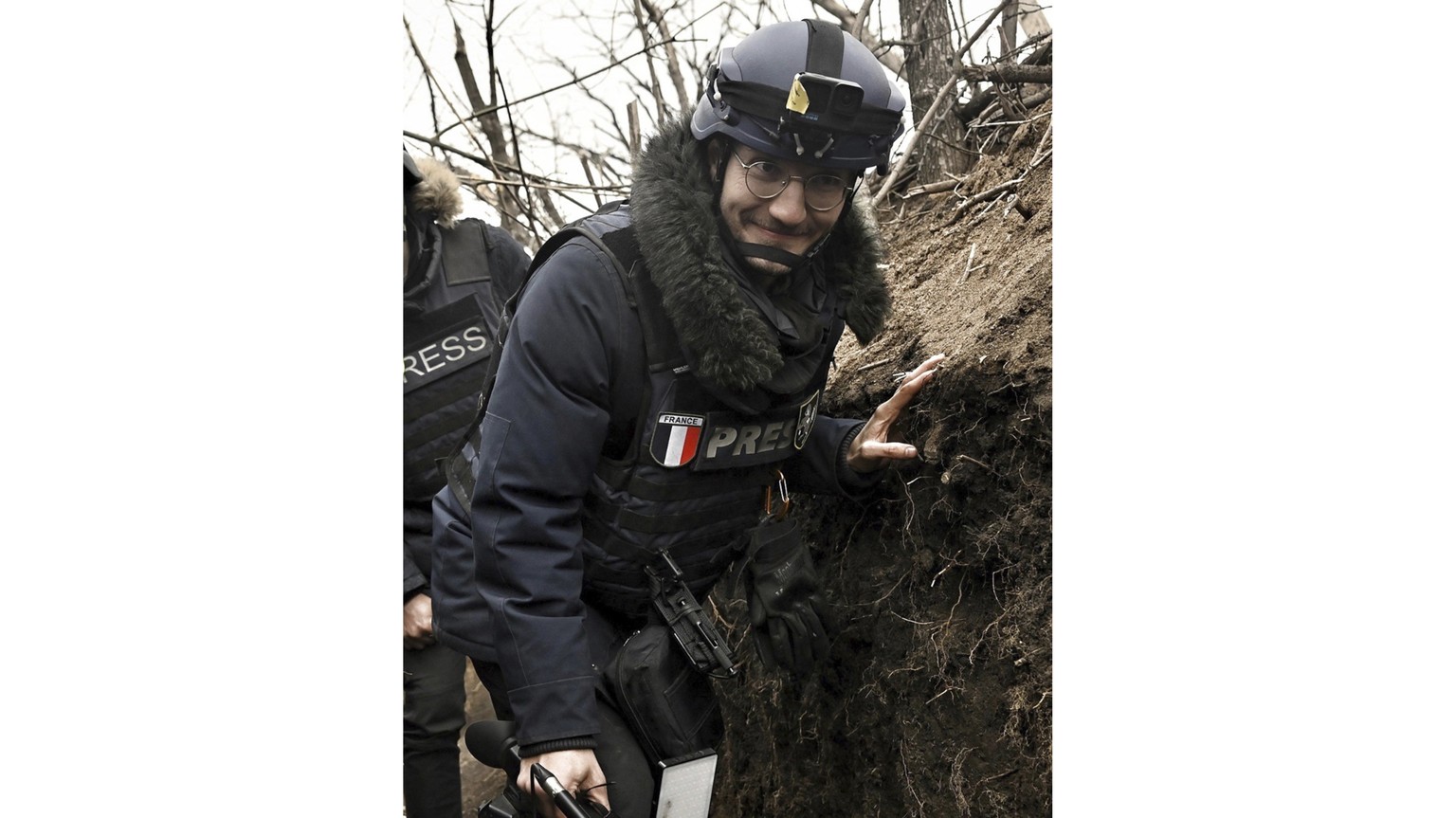 AFP journalist Arman Soldin walks in a trench as he covers the war in Ukraine, March 18, 2023. French international news agency Agence France-Presse says its Ukraine video coordinator Arman Soldin was ...