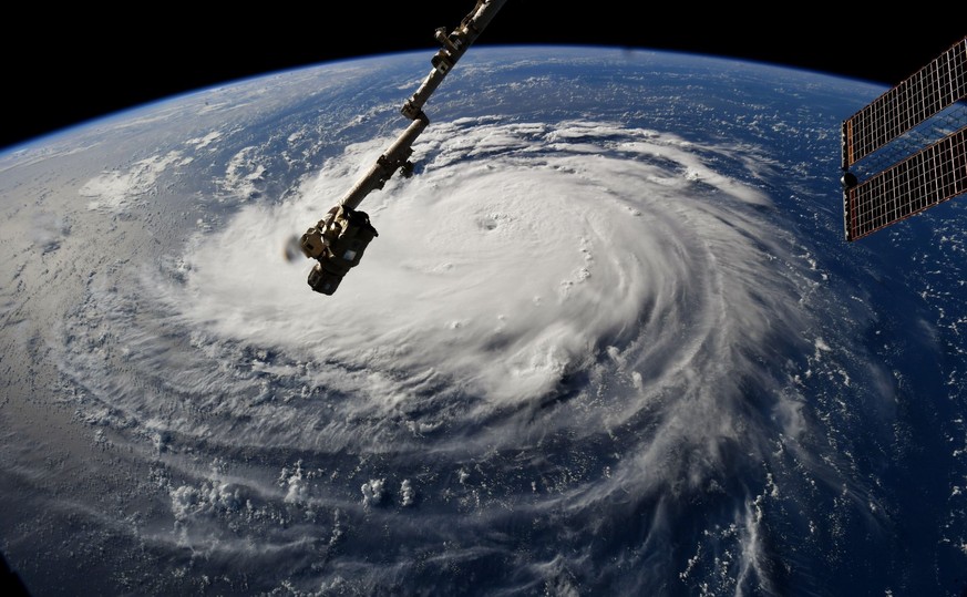 epa07010948 A handout photo made available by NASA shows Hurricane Florence over the Atlantic Ocean, seen from the International Space Station, (issued 10 September 2018). Hurricane Florence has been  ...