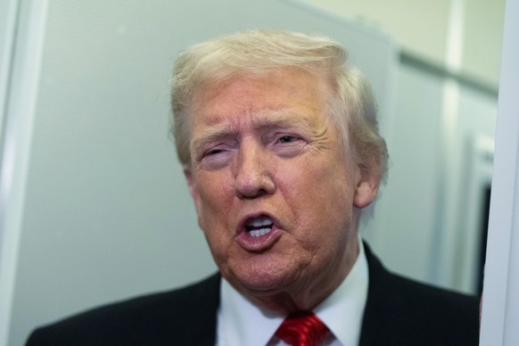 President Donald Trump speaks to reporters on board Air Force One on his way back to the White House from a weekend trip at his Mar-a-Lago estate in Palm Beach, Fla., Sunday, Nov. 2, 2025. (AP Photo/M ...