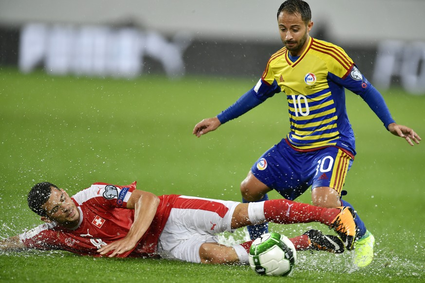 Swiss Remo Freuler, left, fights for the ball against Andorras Ludovic Clemente, right, during the 2018 Fifa World Cup Russia group B qualification soccer match between Switzerland and Andorra at the  ...