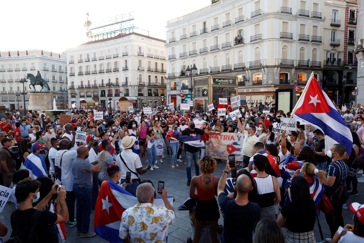 epa09340942 People attend a protest under the motto 'Por una Cuba libre' (lit. For a free Cuba) to demand the end of the communist dictatorship at Sol square in Madrid, Spain, 12 July 2021.  ...