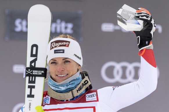 epa09635625 Lara Gut-Behrami of Switzerland celebrates on the podium after winning the women&#039;s Super-G race of the FIS Alpine Skiing World Cup in St. Moritz, Switzerland, 11 December 2021. EPA/PE ...