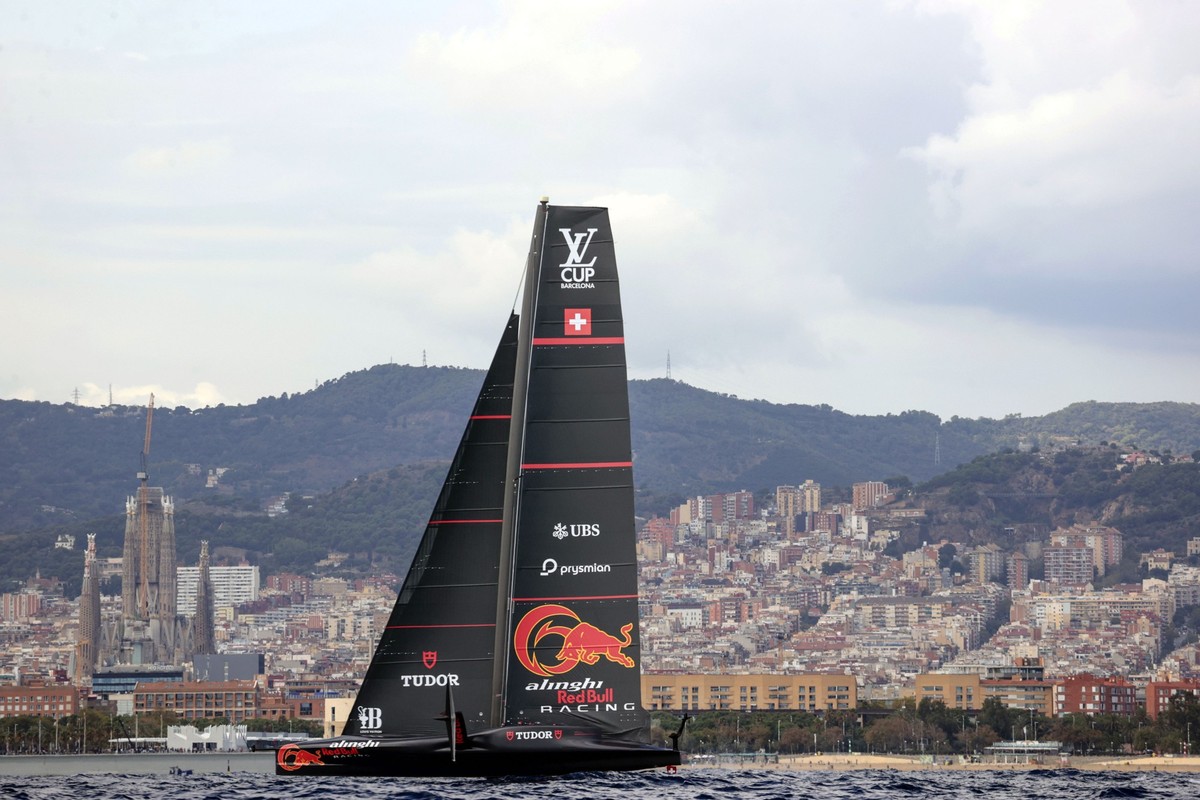 epa11611774 Alinghi Red Bull Racing of Switzerland and INEOS Britannia (unseen) of Britain compete on the fourth day of the Louis Vuitton Cup Semi-Finals within the America's Cup sailing competit ...