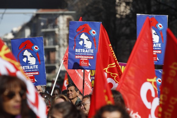 epa10546809 Protesters hold banners calling for a referendum on retirement during a protest against government&#039;s pension reform at Nice, France, 28 March 2023. France faces an ongoing national st ...