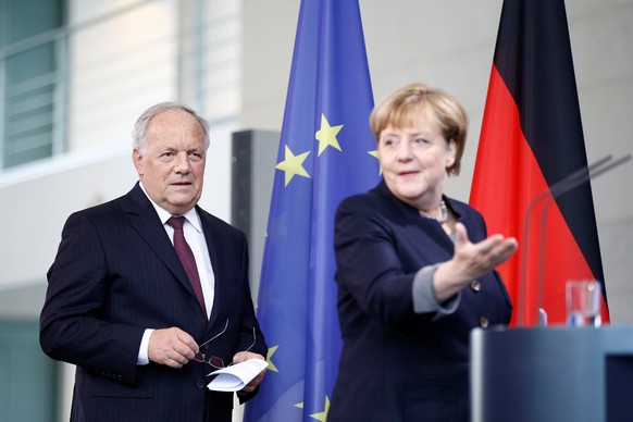 German Chancellor Angela Merkel and Swiss President Johann Schneider-Ammann attend a media conference in the chancellery in Berlin, Germany, November 2, 2016. REUTERS/Axel Schmidt