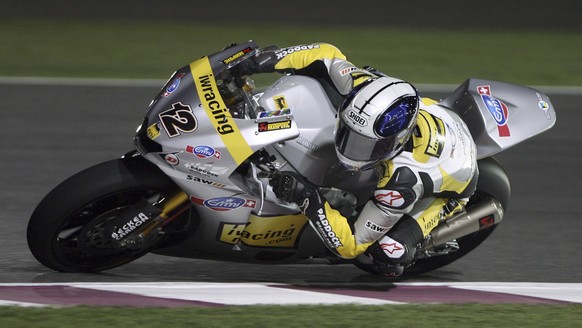 Moto2 rider Thomas Luethi of Switzerland makes a turn during the Grand Prix of Qatar at the Losail International Circuit in Doha, Qatar, Sunday, April 11, 2010. (AP Photo/Osama Faisal)