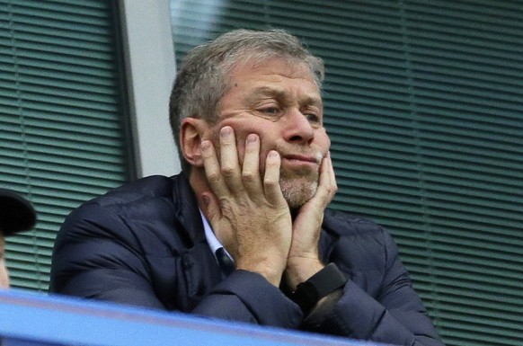 FILE - Chelsea soccer club owner Roman Abramovich sits in his box before their English Premier League soccer match against Sunderland at Stamford Bridge stadium in London, Dec. 19, 2015.Unpreceded res ...