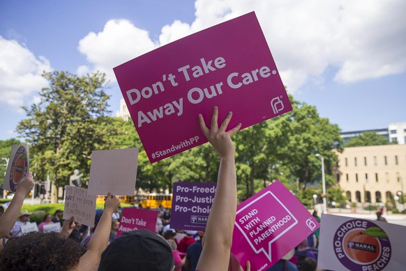 FILE - In this Tuesday, May 7, 2019, file photo, protesters rally outside of the Georgia State Capitol following the signing of HB 481, in Atlanta. Georgia Governor Brian Kemp signed legislation on Tu ...