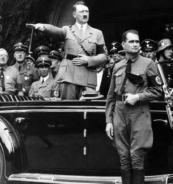 FILE - The Dec. 30 1938 file photo shows German Chancellor Adolf Hitler and his personal representative Rudolf Hess, right, during a parade in Berlin, Germany, on Dec. 30, 1938. Minister of Propaganda ...