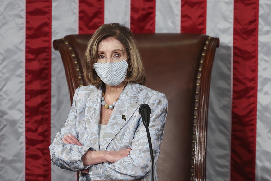 epa08917998 Speaker of the House Nancy Pelosi (D-CA) waits during votes in the first session of the 117th Congress in the House Chamber at the US Capitol in Washington, DC, USA, 03 January 2021. EPA/T ...