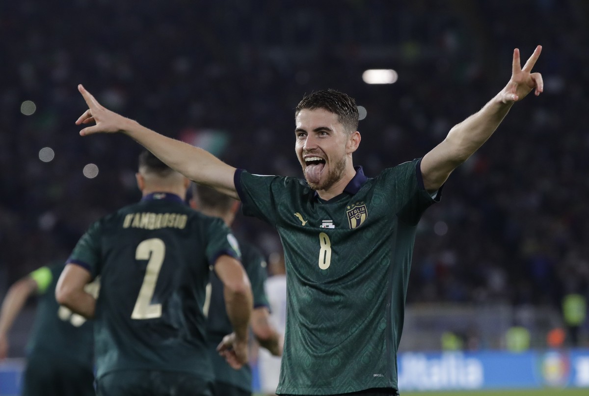Italy's Jorginho celebrates after he scores the opening goal of the game from the penalty spot during the Euro 2020 group J qualifying soccer match between Italy and Greece in Rome, Italy, Saturd ...