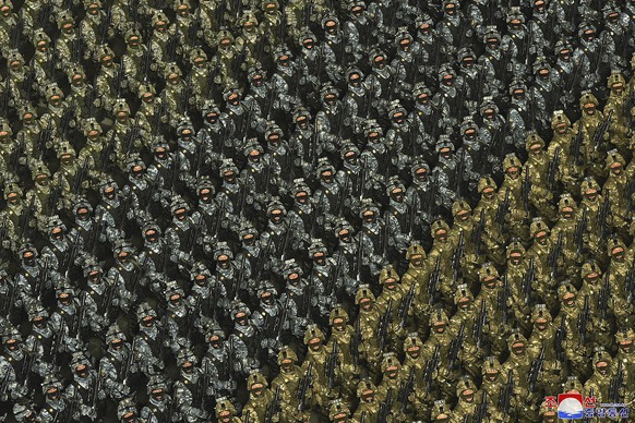 FILE - In this photo provided by the North Korean government, soldiers march during a military parade to mark the 75th founding anniversary of the Korean People&#039;s Army on Kim Il Sung Square in Py ...