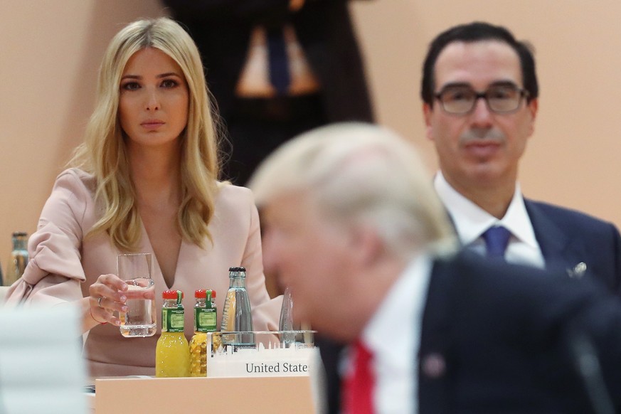 epa06075575 Ivanka Trump (L), daughter and personal adviser of US President Donald J. Trump and US Treasury Secretary Steven Mnuchin look on as US President Donald Trump arrives for the morning workin ...