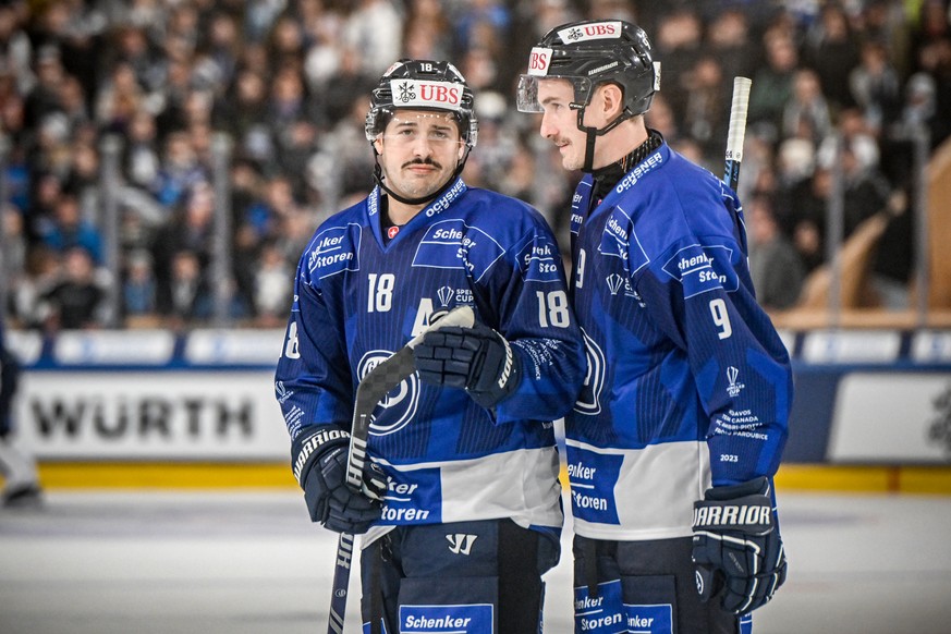 Ambri&#039;s Inti Pestoni, left, and Laurent Dauphin during the game between Switzerland&#039;s HC Ambri-Piotta and the Czech HC Republic&#039;s Dynamo Pardubice, at the 95th Spengler Cup ice hockey t ...