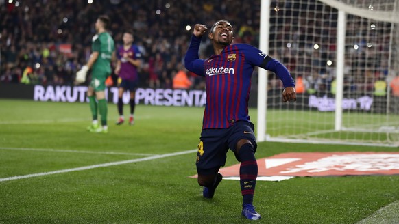 FC Barcelona&#039;s Malcom celebrates after scoring during a Spanish Copa del Rey soccer match between FC Barcelona and Cultural Leonesa at the Camp Nou stadium in Barcelona, Spain, Wednesday, Dec. 5, ...